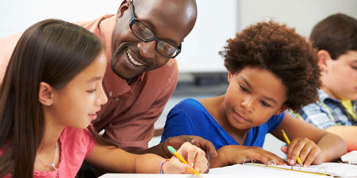 teacher with young students